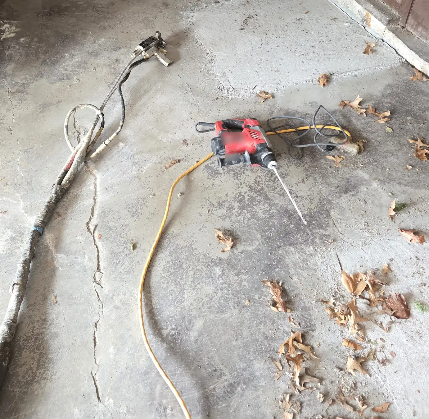 A crack in a concrete floor slab near a daylight opening -- PolyJacks concrete leveling serving Shawnee, KS.